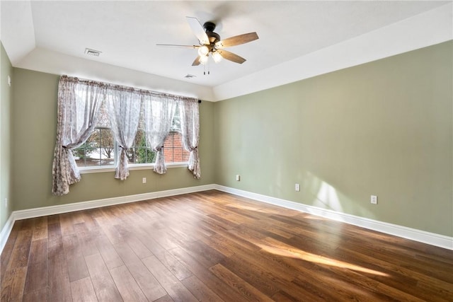 spare room with lofted ceiling, hardwood / wood-style floors, and ceiling fan