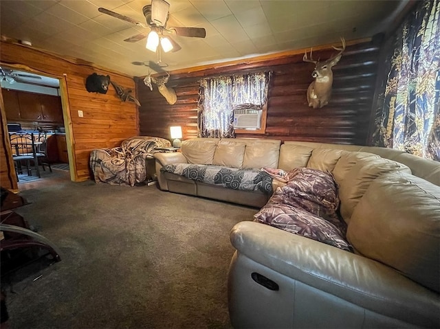 carpeted living room with log walls, ceiling fan, and a healthy amount of sunlight