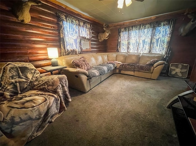 living room with cooling unit, carpet, ceiling fan, and rustic walls