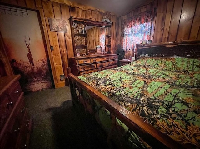 carpeted bedroom with wooden walls