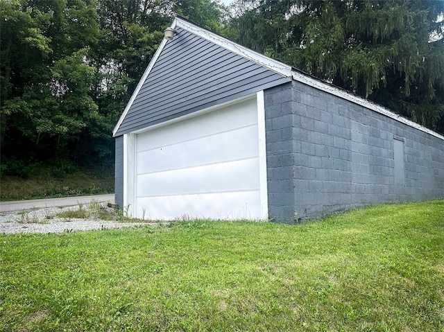 garage featuring a yard