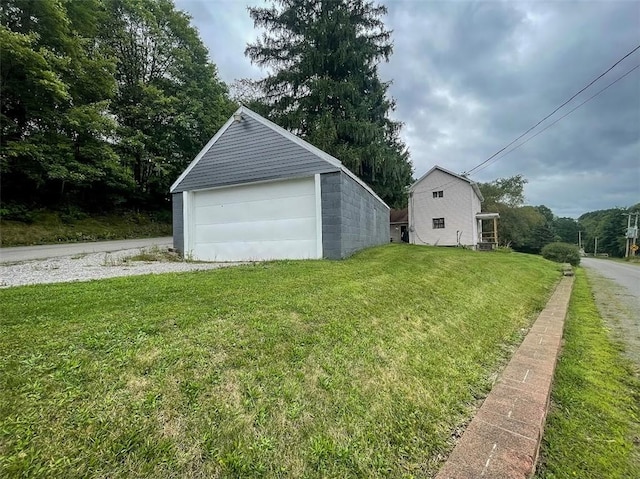 garage with a yard