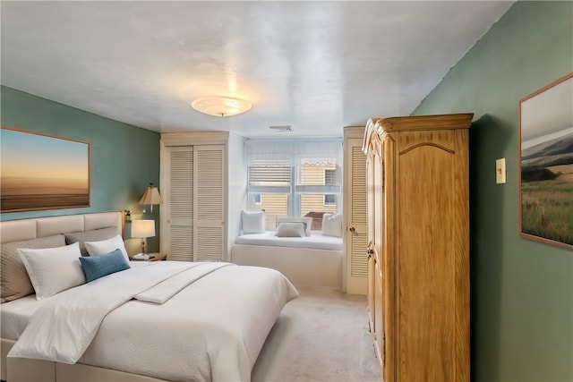 carpeted bedroom featuring a closet