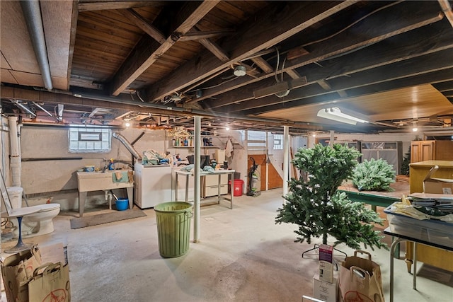 basement featuring sink and a wealth of natural light