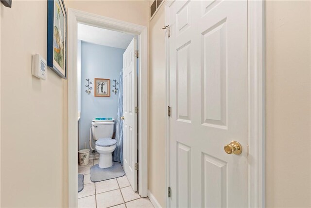 hallway featuring light tile patterned floors