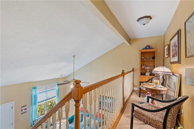 hall featuring vaulted ceiling with beams, an upstairs landing, baseboards, and light colored carpet