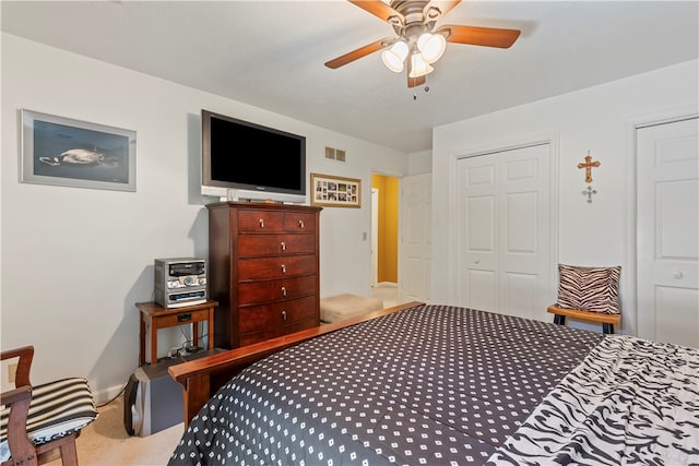 bedroom featuring a closet, carpet, and ceiling fan