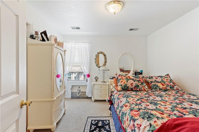 bedroom with light carpet and visible vents