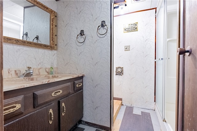 bathroom featuring vanity and a shower