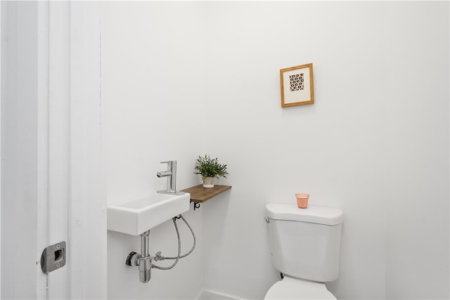 bathroom with toilet and sink