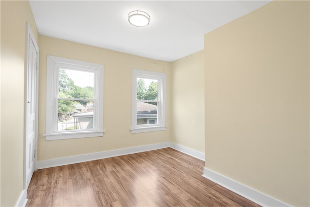 spare room with light wood-type flooring