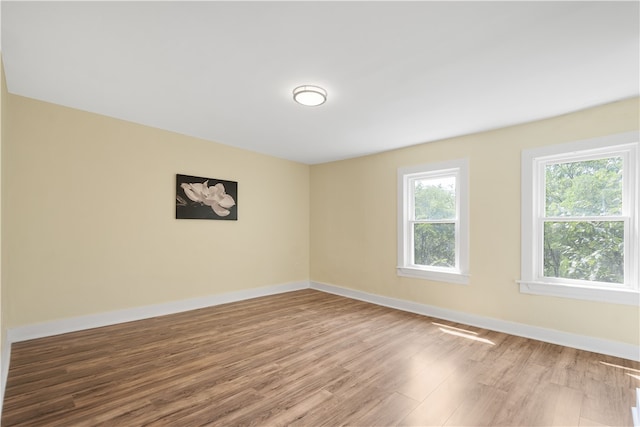 unfurnished room featuring hardwood / wood-style floors