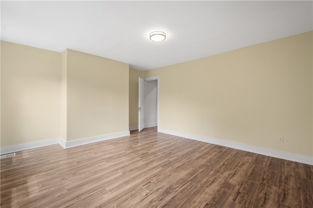 spare room featuring light wood-type flooring