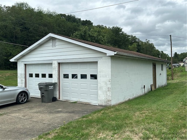 garage featuring a yard