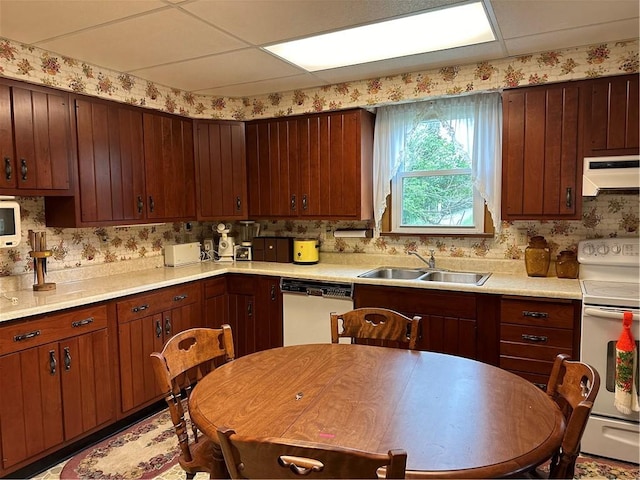 901 Clearfield Rd, Clearfield Twp, PA 16034 - kitchen featuring light countertops, under cabinet range hood, white electric range, dishwashing machine, and a sink