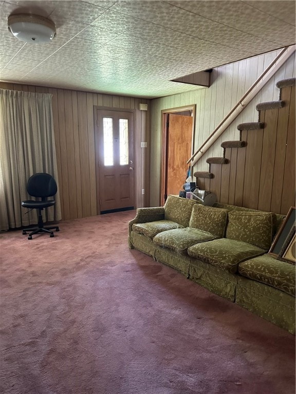 living room with carpet flooring and wooden walls