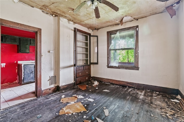 spare room with ceiling fan and hardwood / wood-style flooring