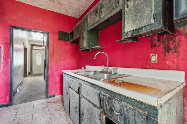 kitchen featuring sink and light tile patterned floors