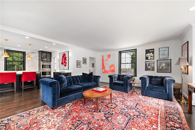 living room featuring ornamental molding, dark hardwood / wood-style floors, and a wealth of natural light