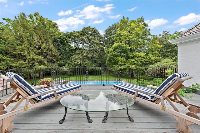 wooden terrace with a pool