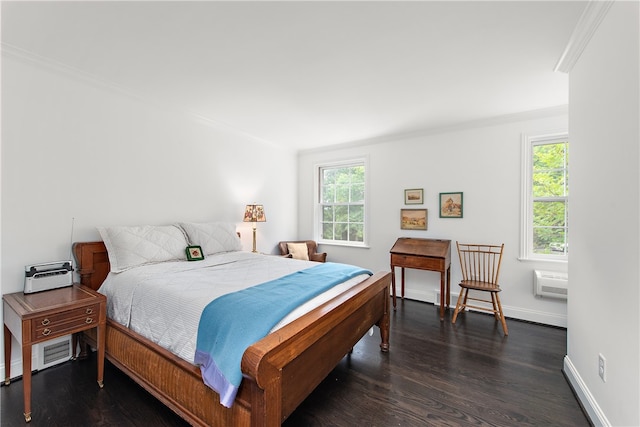 bedroom with a wall unit AC, dark hardwood / wood-style flooring, and crown molding