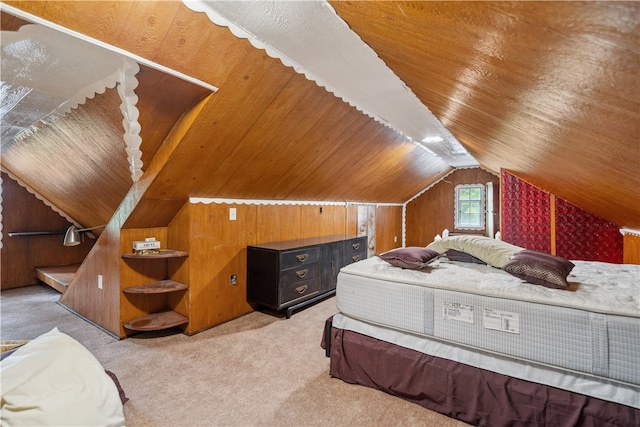 bedroom featuring wooden walls, lofted ceiling, and carpet floors