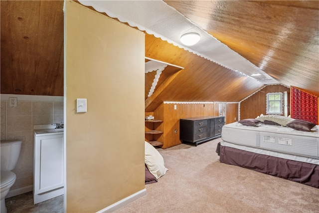 bedroom with lofted ceiling and carpet floors