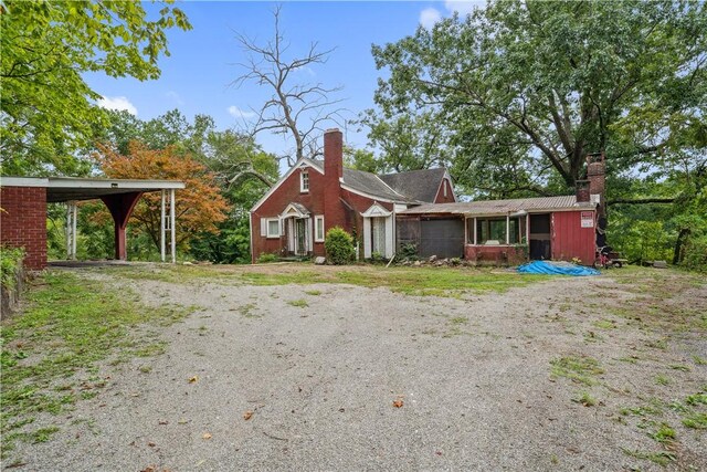 single story home featuring a carport