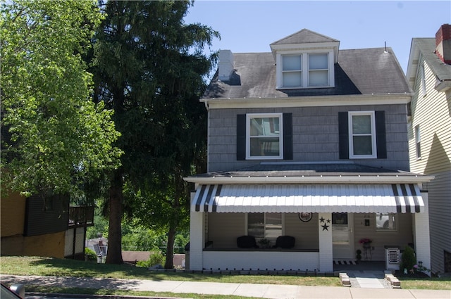 view of front of property with cooling unit