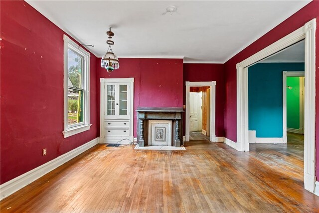 unfurnished living room with hardwood / wood-style floors