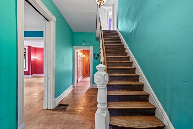 staircase featuring hardwood / wood-style floors