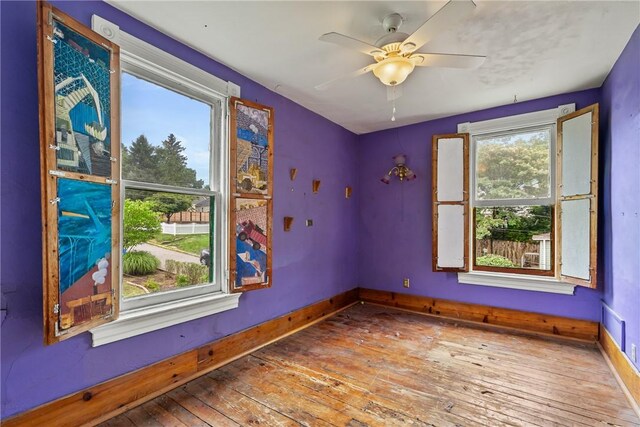 unfurnished room featuring ceiling fan and wood-type flooring