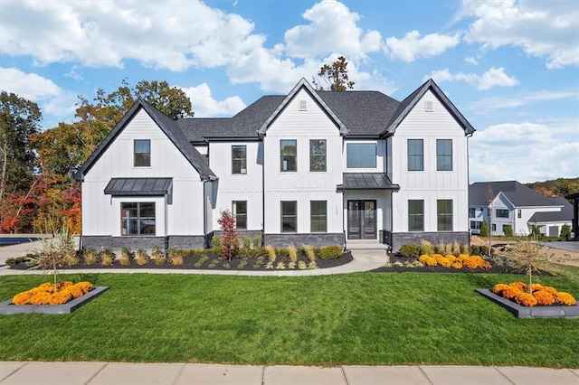 modern farmhouse with a front lawn