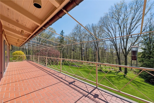 view of patio featuring a balcony