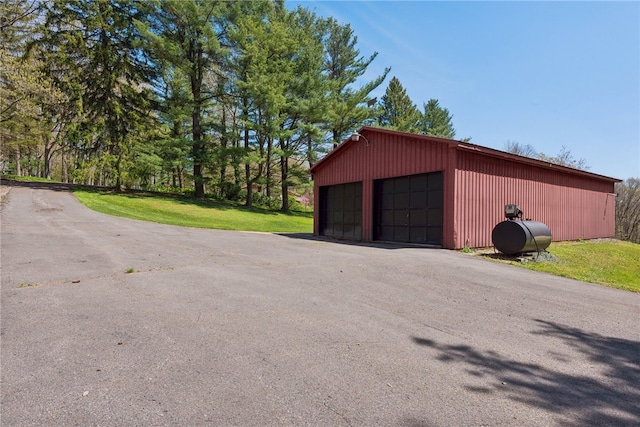 garage featuring a yard