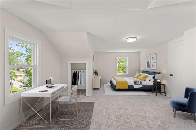 office area featuring vaulted ceiling, light colored carpet, and plenty of natural light