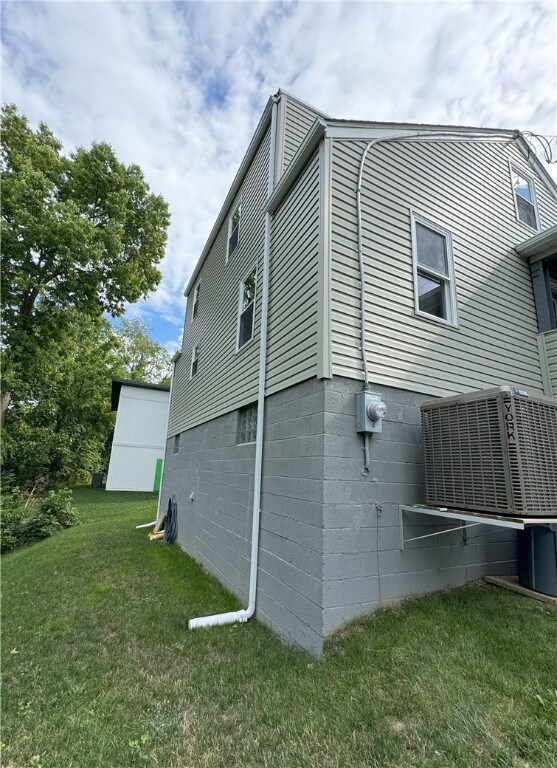 view of home's exterior with a yard