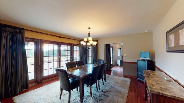 1490 Olde Stable Ln, Moon/Crescent Twp, PA 15108 - dining room with a chandelier, healthy amount of natural light, dark wood finished floors, and baseboards