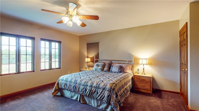 bedroom featuring dark colored carpet and ceiling fan