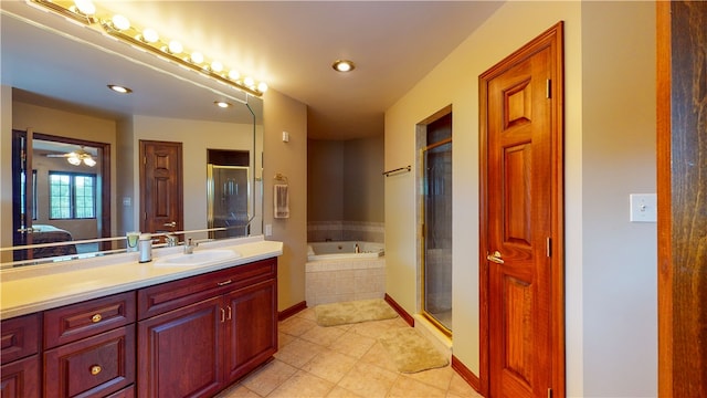 bathroom featuring ceiling fan, tile patterned floors, vanity, and separate shower and tub