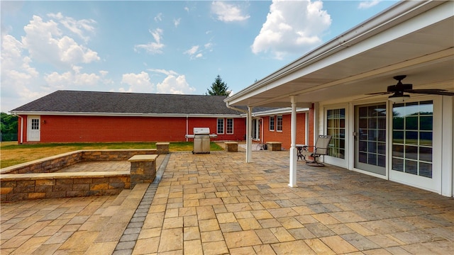 view of patio / terrace with ceiling fan and a grill