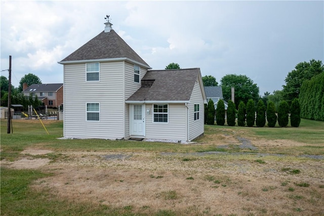 1490 Olde Stable Ln, Moon/Crescent Twp, PA 15108 - rear view of property featuring roof with shingles and a lawn