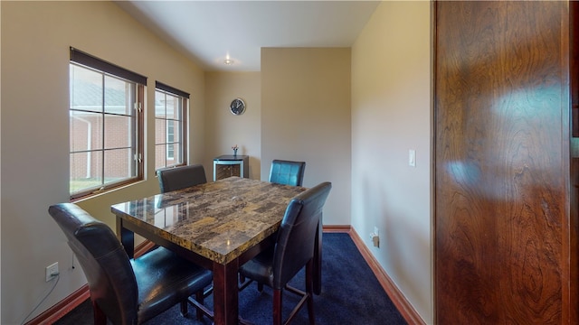 dining room featuring carpet