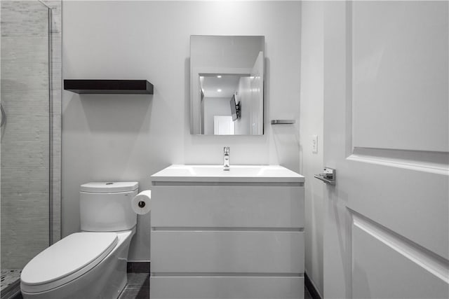 full bathroom featuring toilet, a shower stall, and vanity
