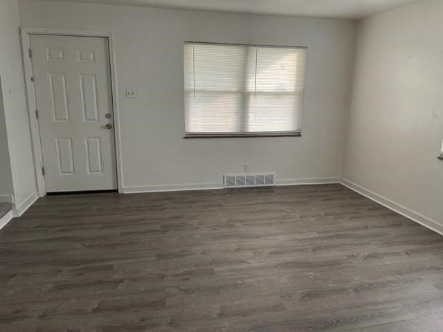 empty room with wood-type flooring