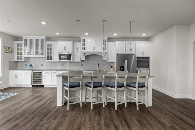 kitchen with wine cooler, dark hardwood / wood-style flooring, built in microwave, and stainless steel fridge with ice dispenser