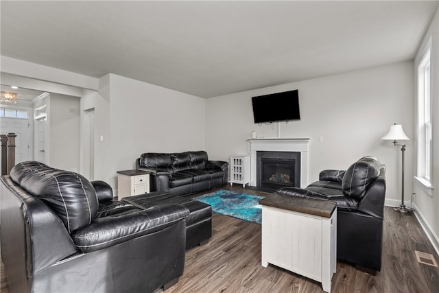 living room with dark hardwood / wood-style flooring