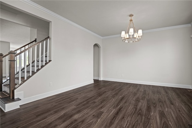 unfurnished room with dark hardwood / wood-style floors, crown molding, and an inviting chandelier