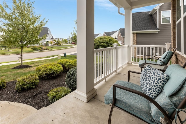 balcony featuring a porch