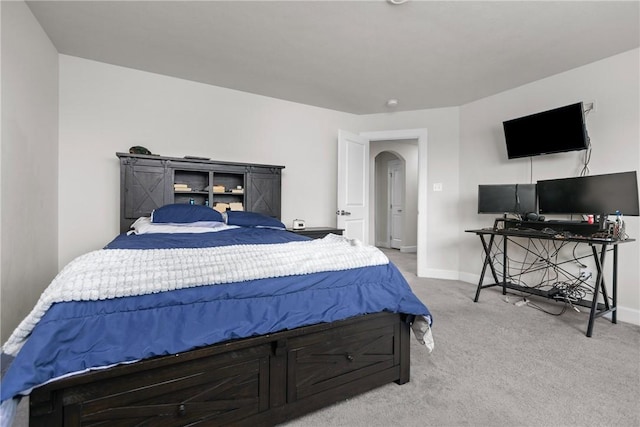 bedroom with light colored carpet